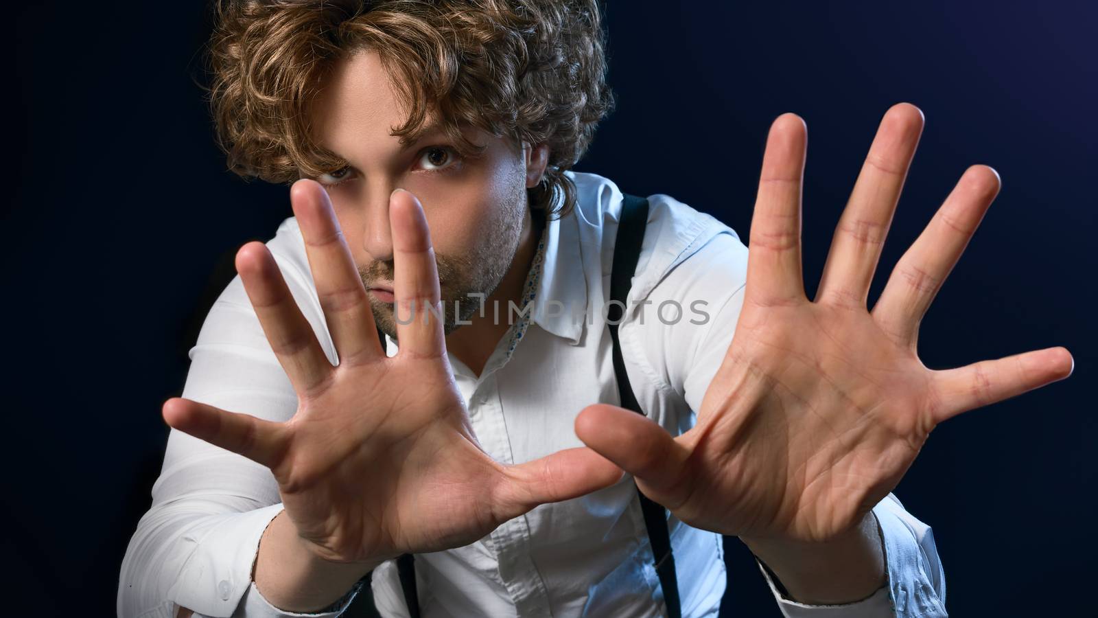 image of a man who performs magic with his hands