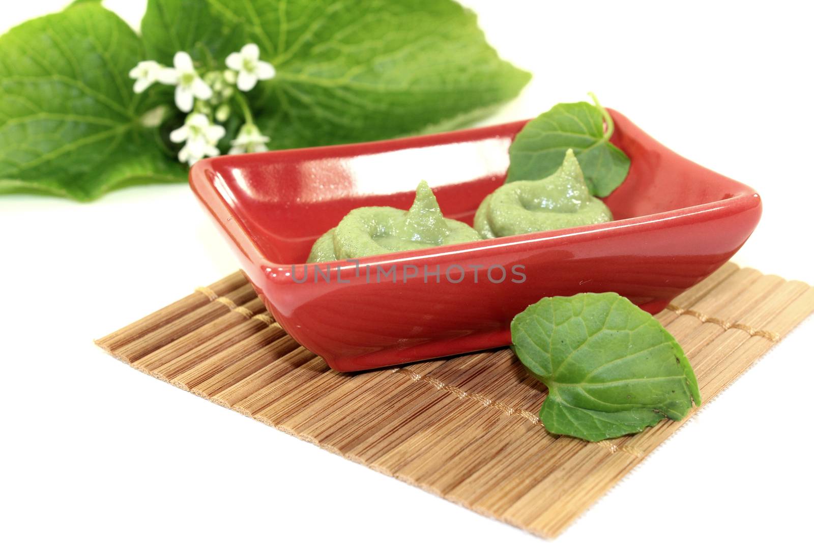 spicy Wasabi with leaf and flower in a red bowl