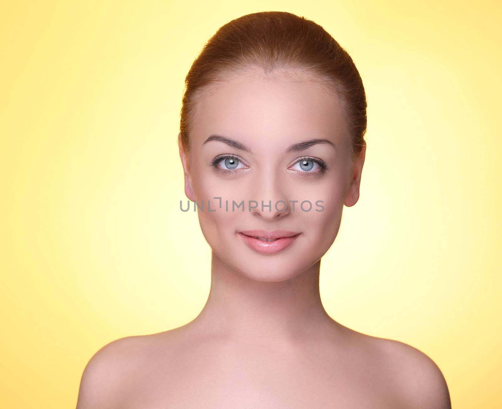 Beautiful girl on a yellow background