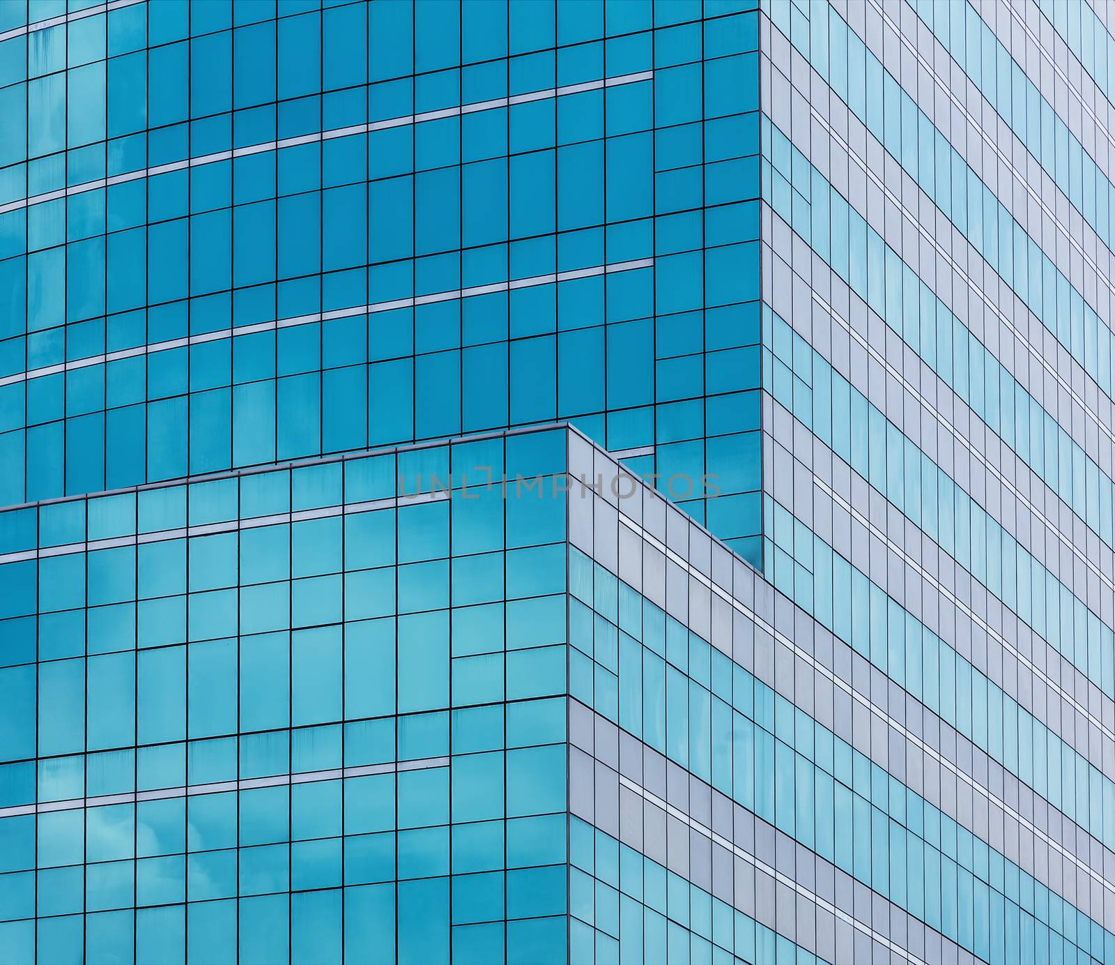 reflecting sky in glass of office building ;geometric  abstract background 