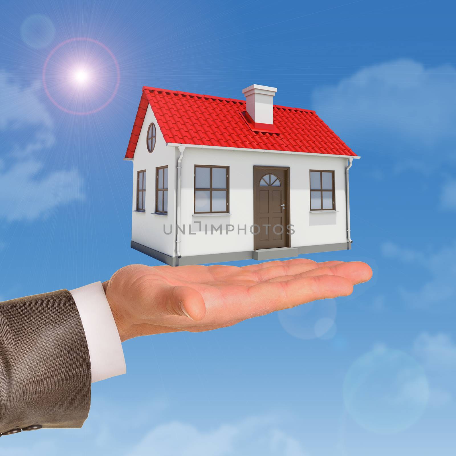 House under businessmans hand on blue sky background 