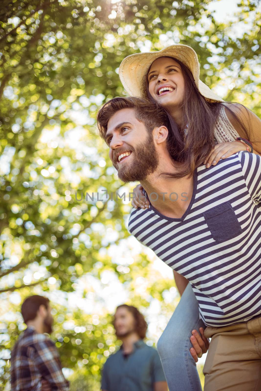 Hipster couple having fun together on a summers day