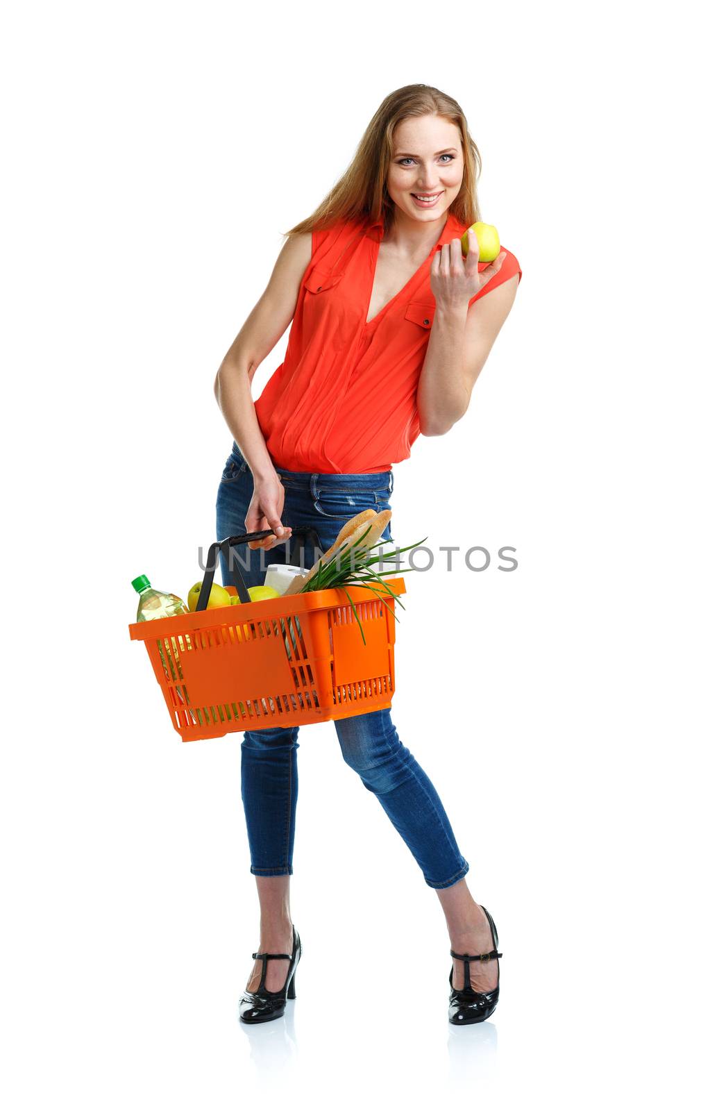Happy woman holding a basket full of healthy food. Shopping by vlad_star