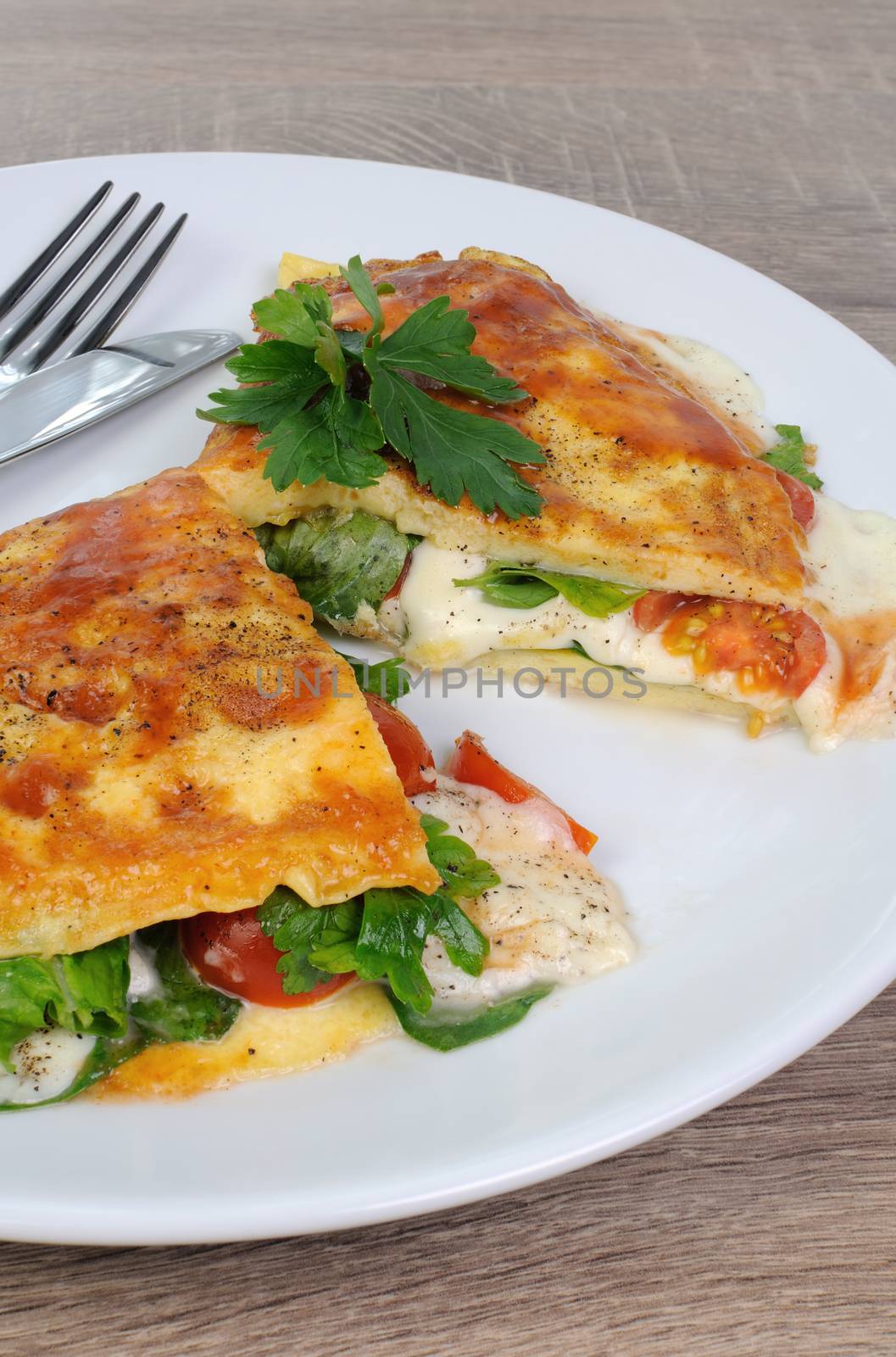 Omelet stuffed with spinach, tomato and  mozzarella