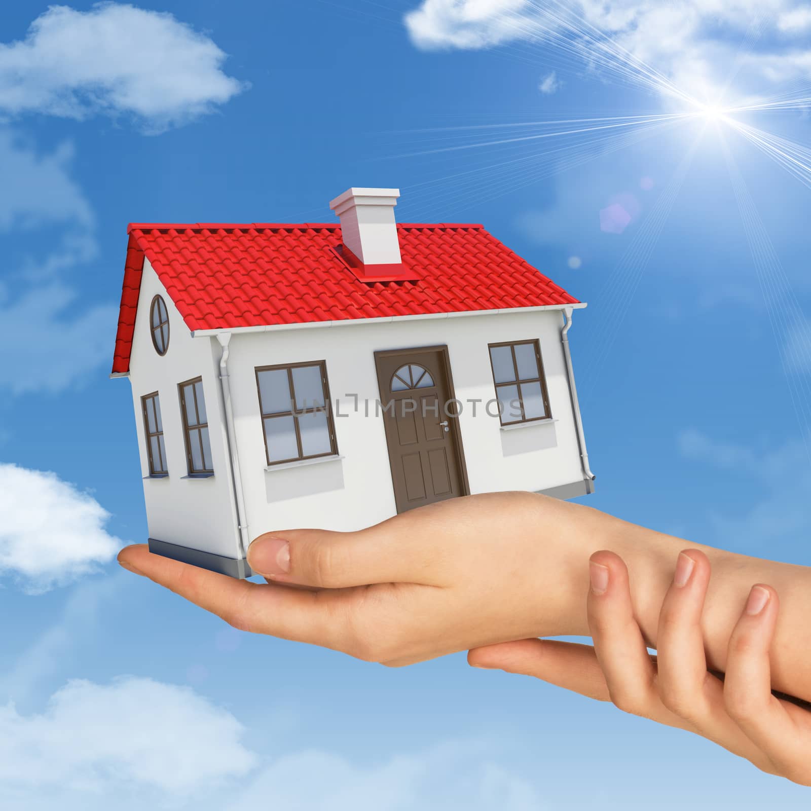 Womans hands holding house on blue sky background 