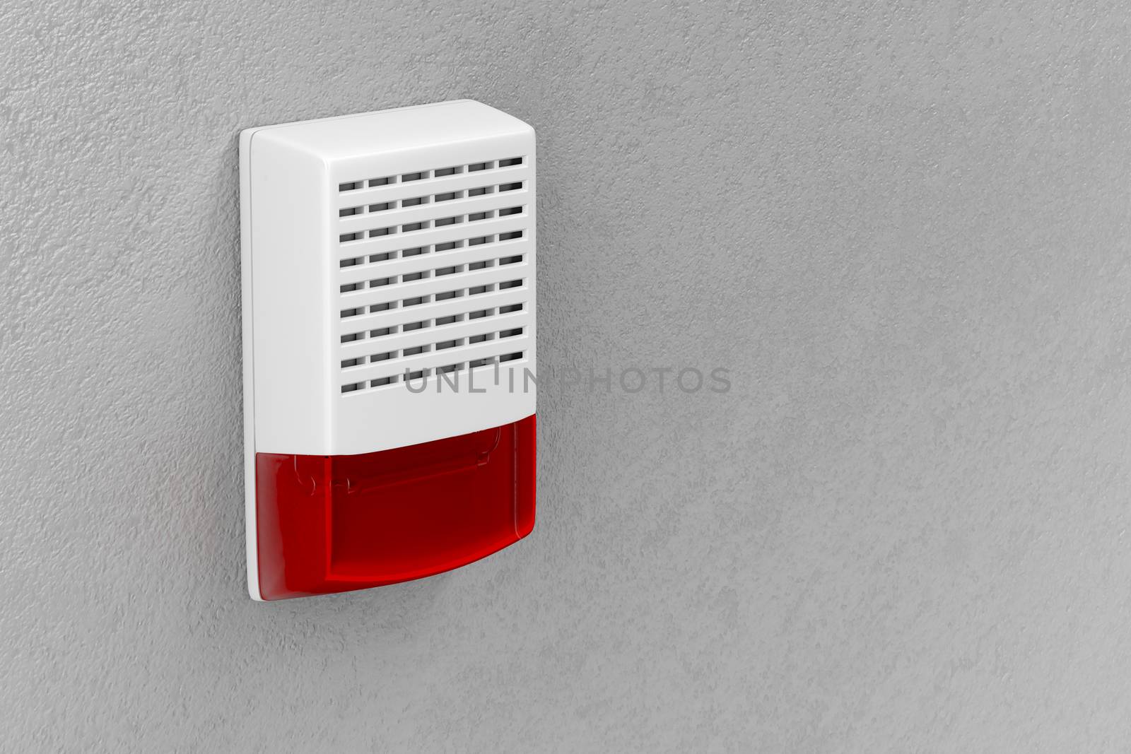 Alarm siren with flash light attached on wall