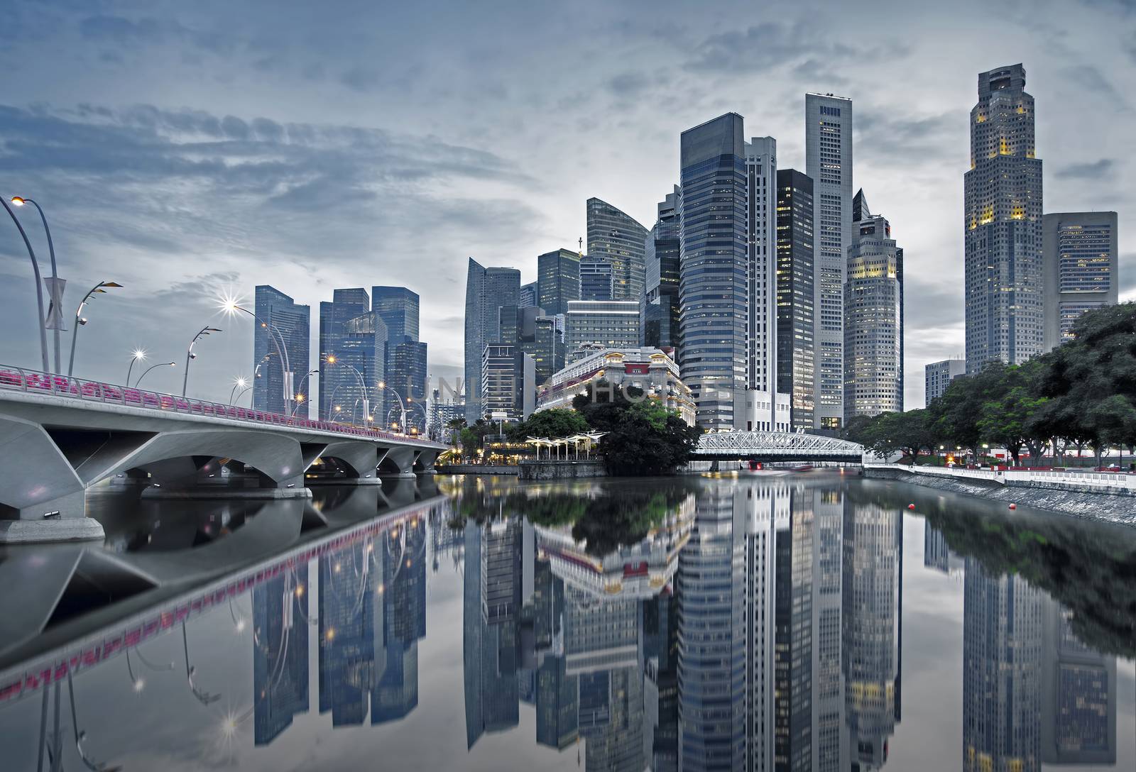 Singapore cityscape casting reflections in the early morning