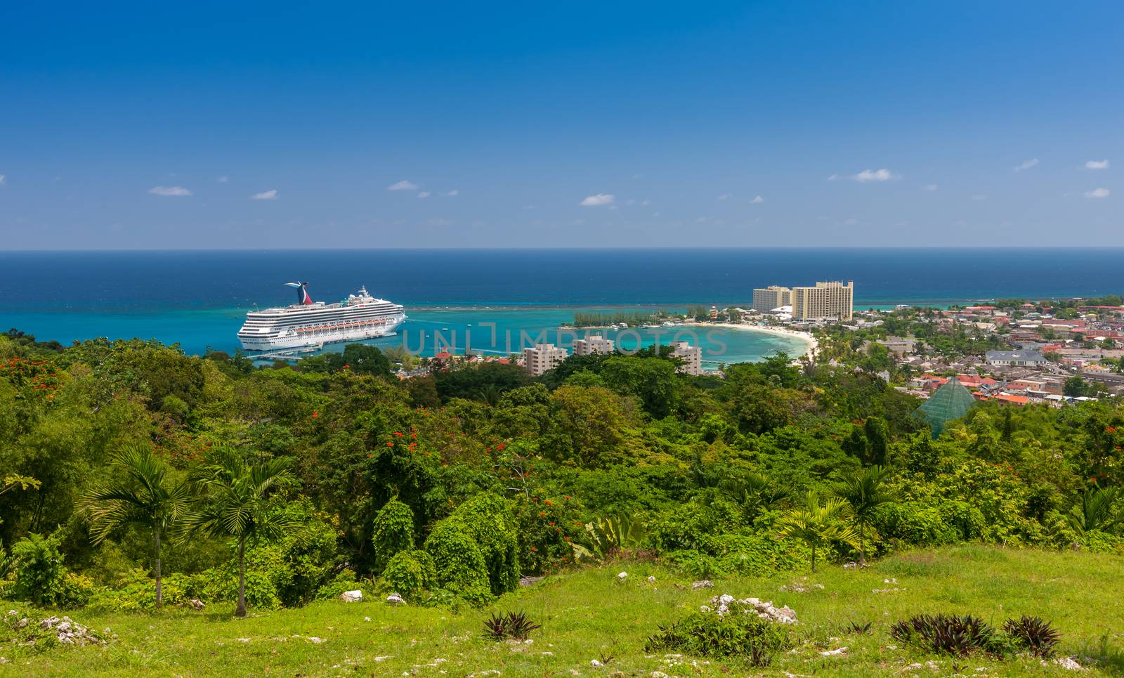 Jamaican Beach A. Caribbean white sand beach on the northern coast of Jamaica, near Dunn's River Falls and the town of Ocho Rios.