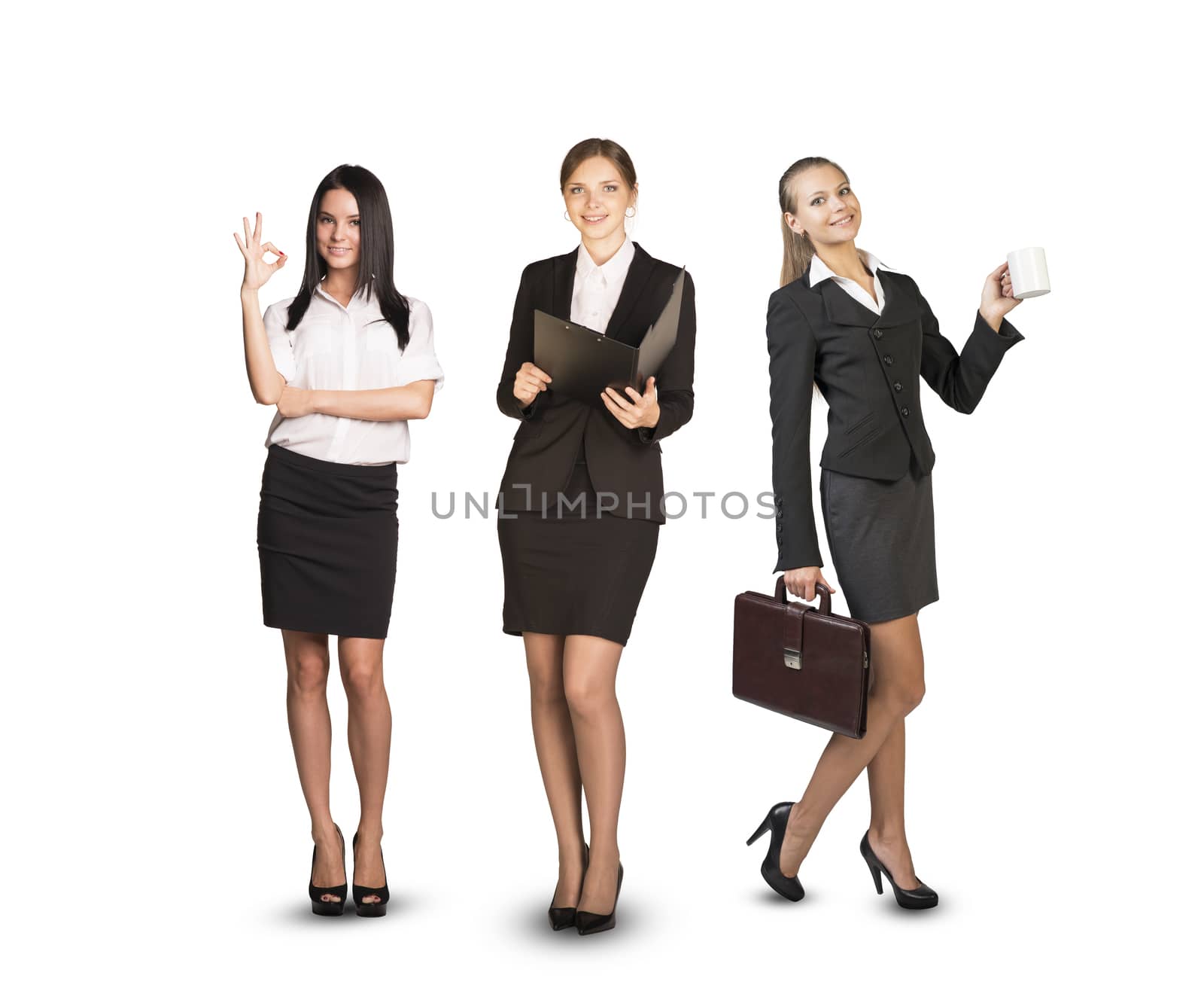 Image of three successful businesswomen looking at camera on isolated white background