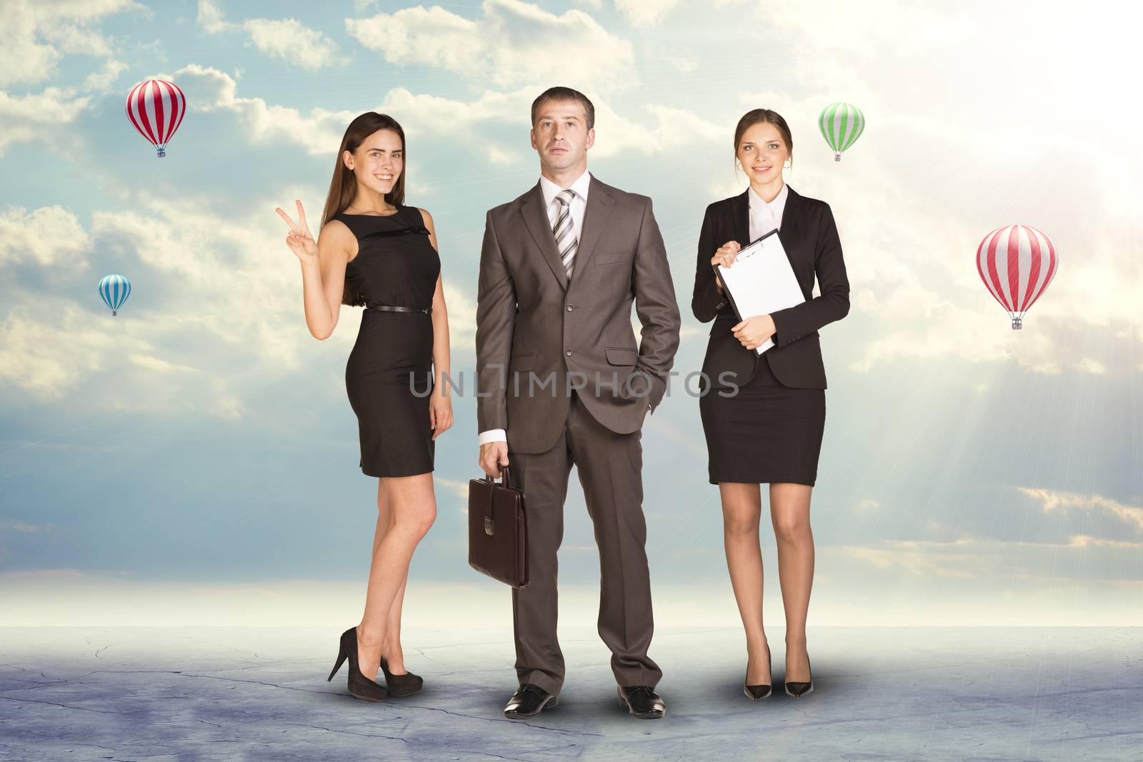 Young attractive business people with women holding blank folder, looking at camera on abstract background