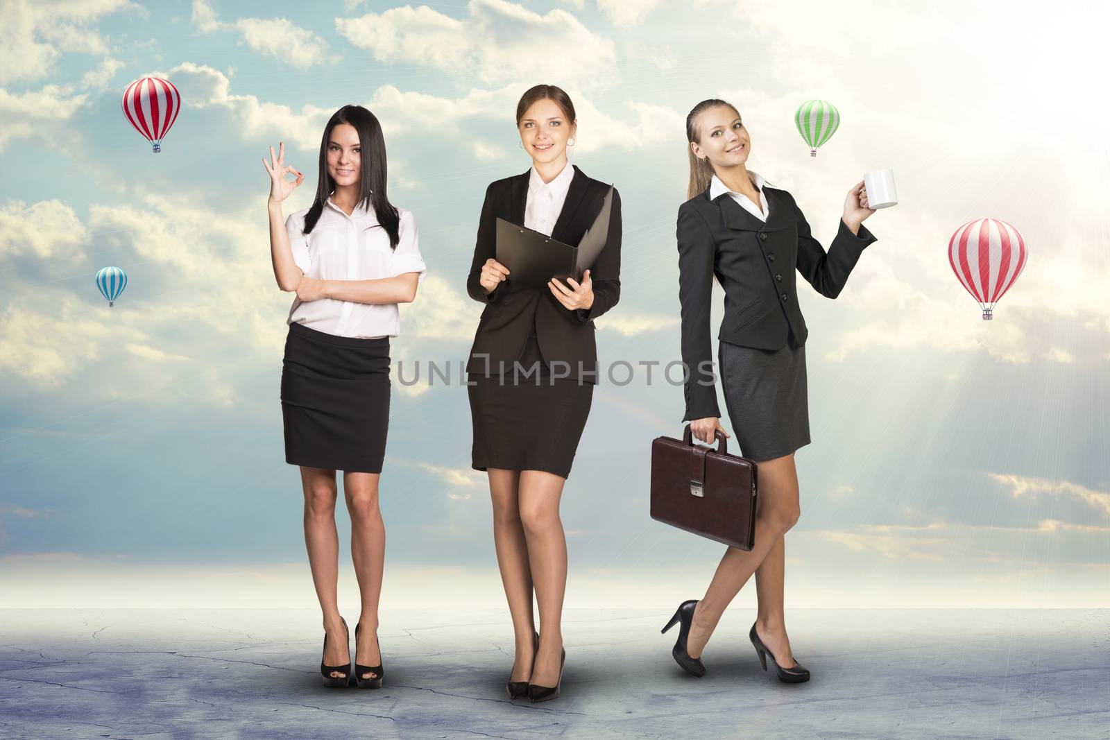 Image of three successful businesswomen looking at camera on abstract background