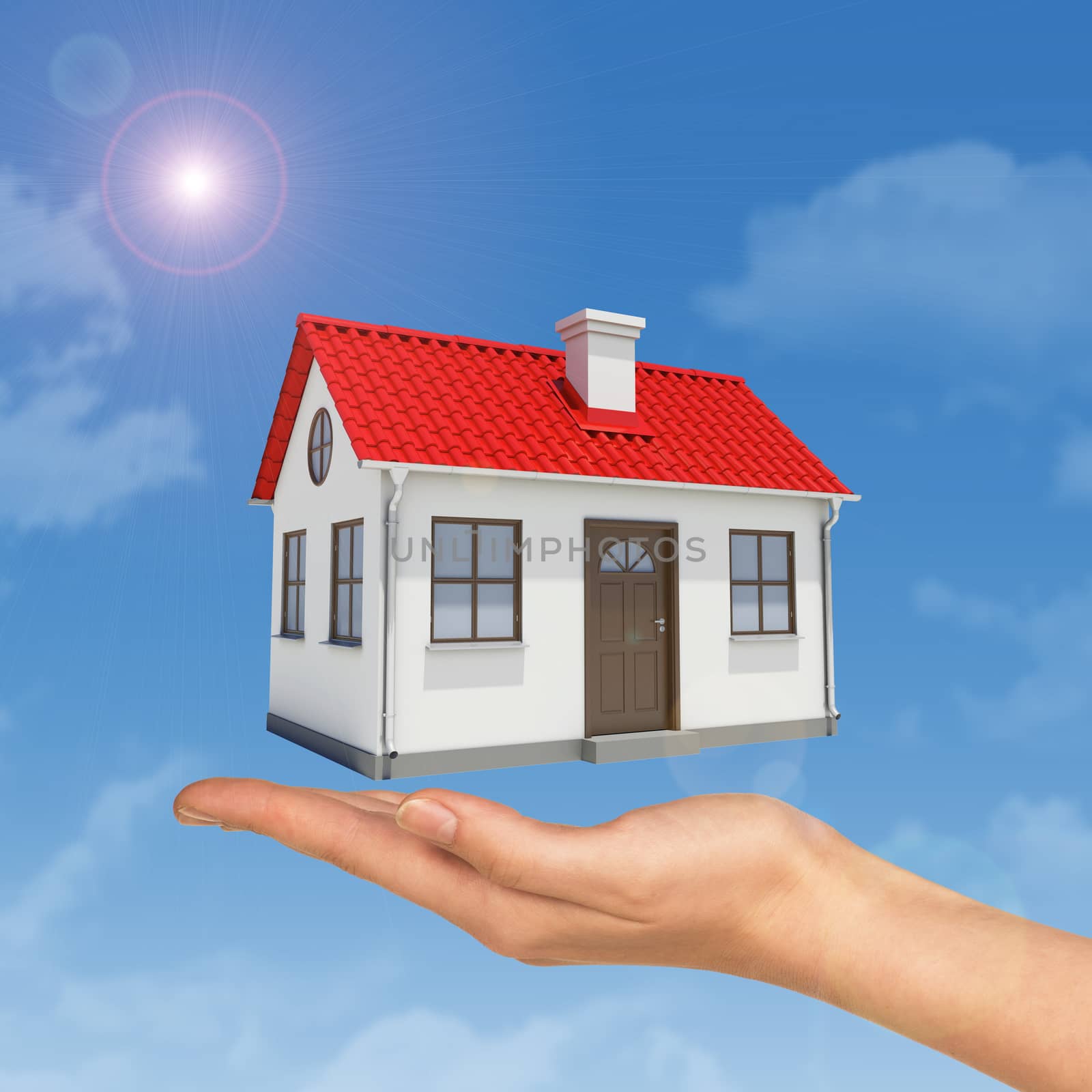 House under businesswomans hand on blue sky background 