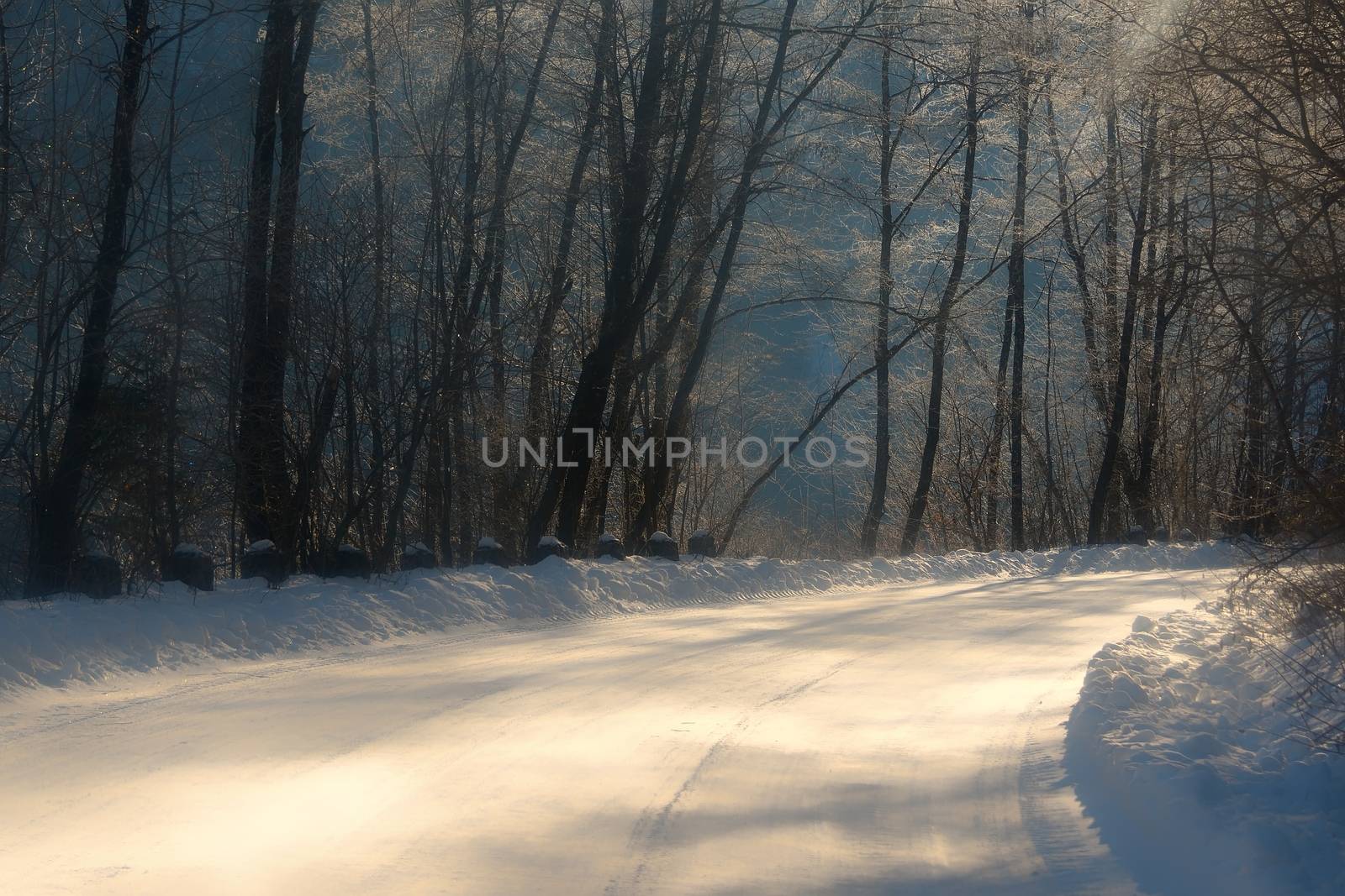 Mountain road in winter season. by comet