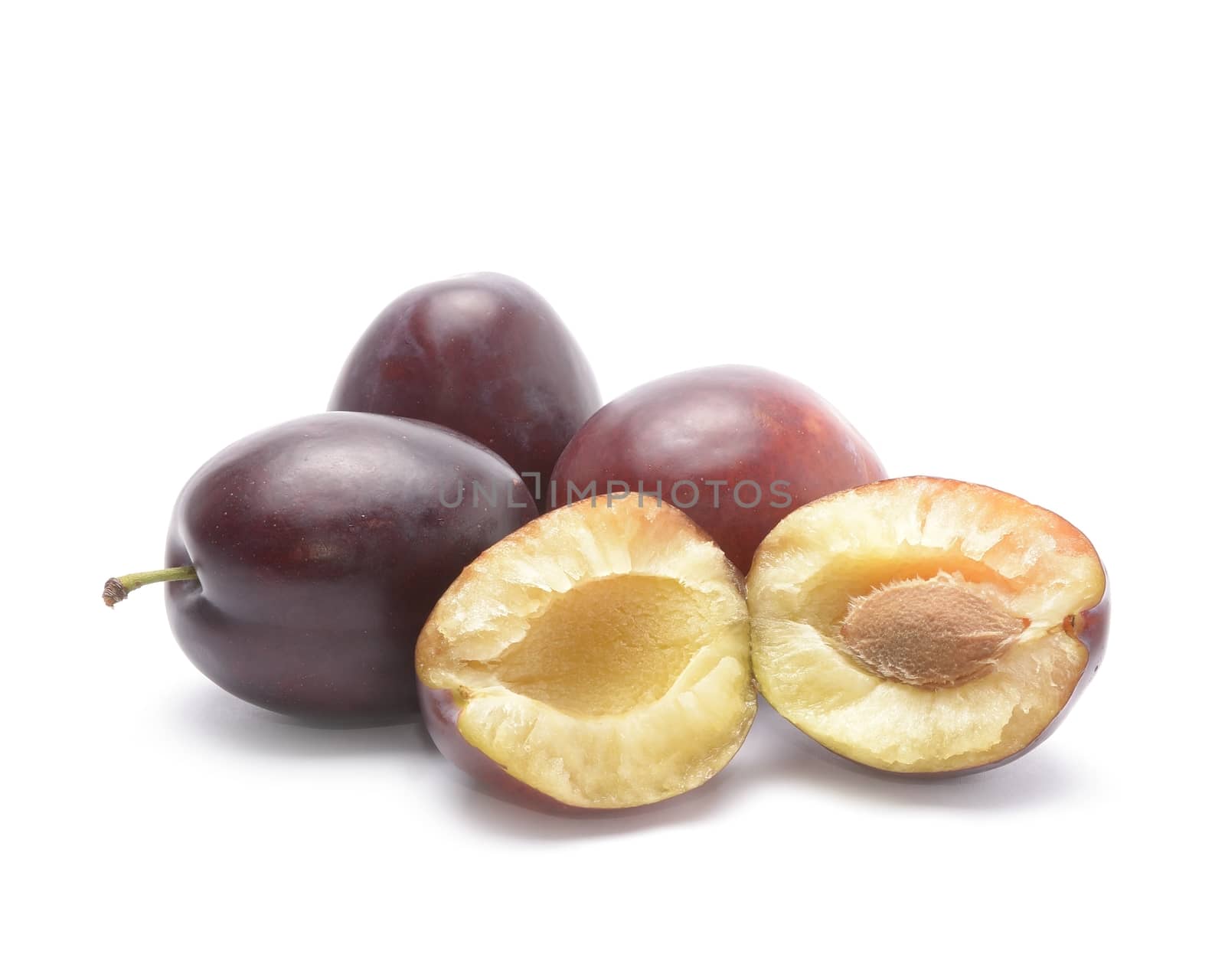blue plums and half isolated on white background