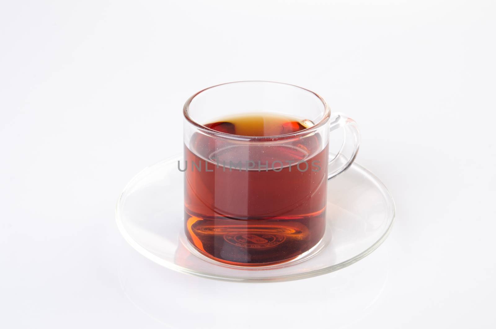 Tea in glass cup on a background. Tea in glass cup on a backgrou by heinteh
