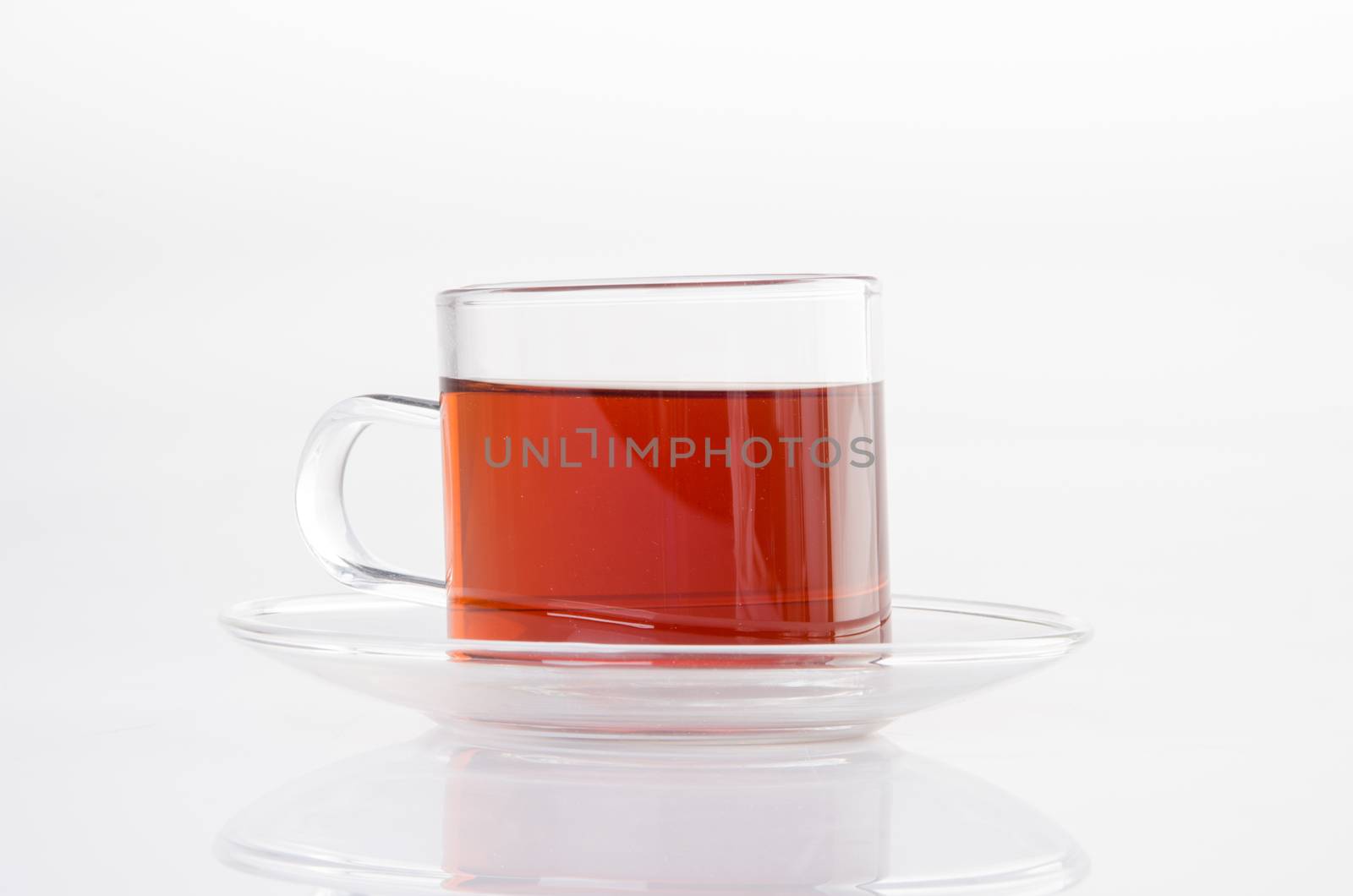 Tea in glass cup on a background. Tea in glass cup on a backgrou by heinteh