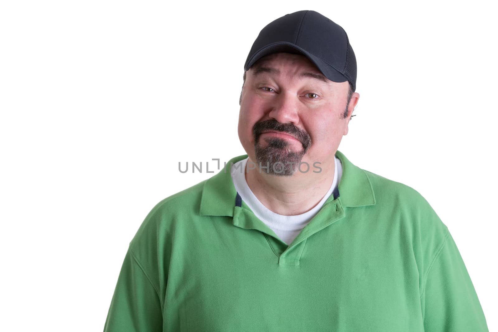 Portrait of a Bearded Adult Man in Green Shirt with Cap Got Emotional Face While Looking at the Camera. Isolated on White Background.