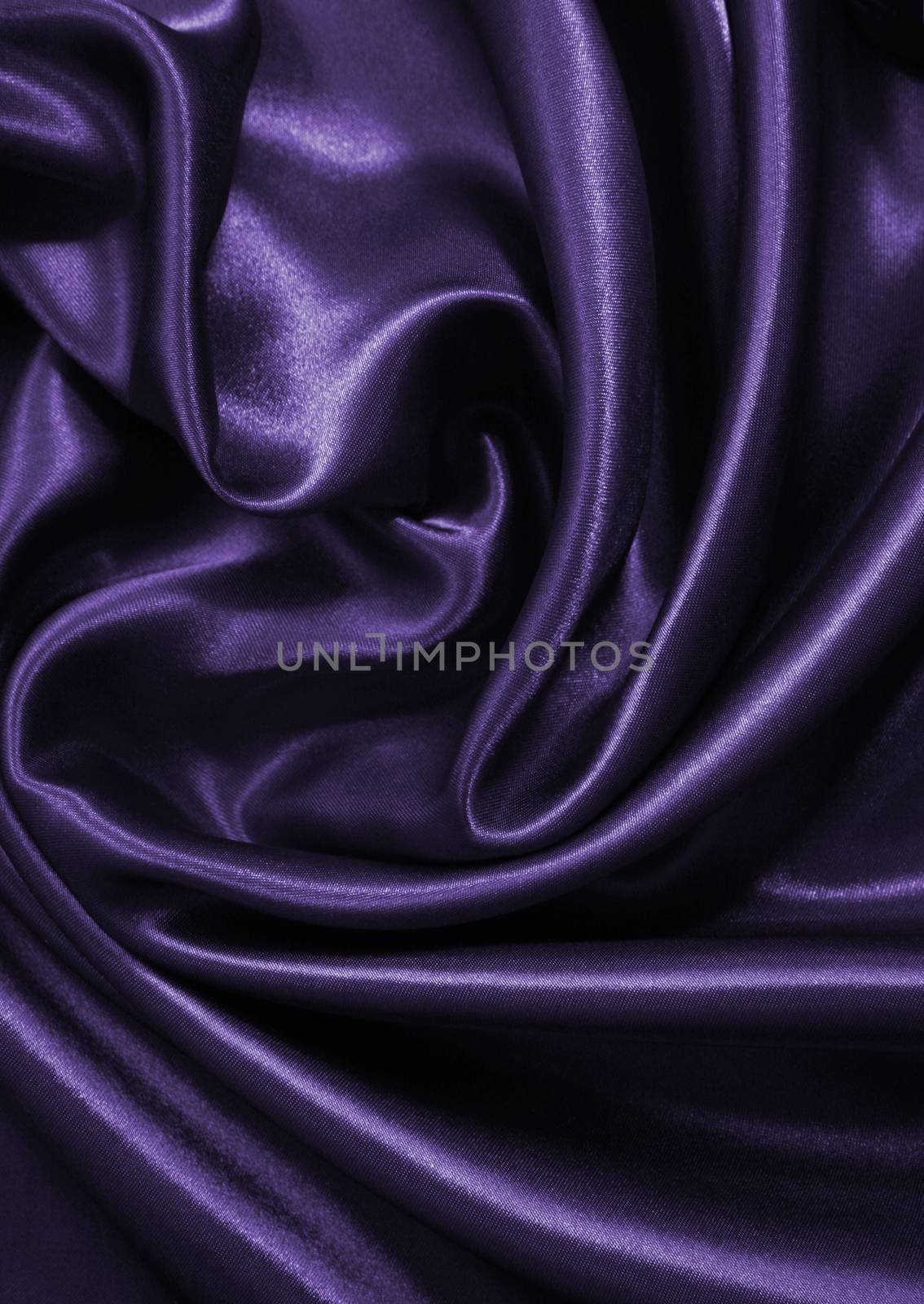 Smooth elegant lilac silk or satin as background 