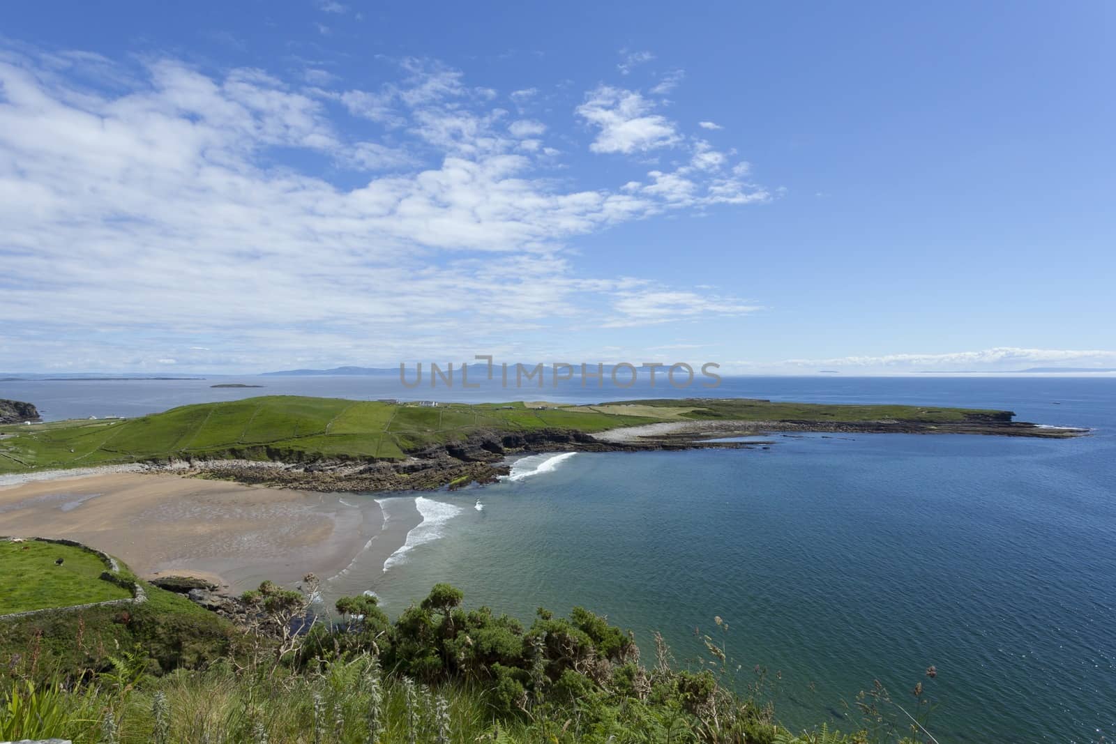 Scenic landscape photo of the Irish coastline in Muckross, Kilcar, Co. Donegal. View of Donegal bay with Benbulbin in the distance