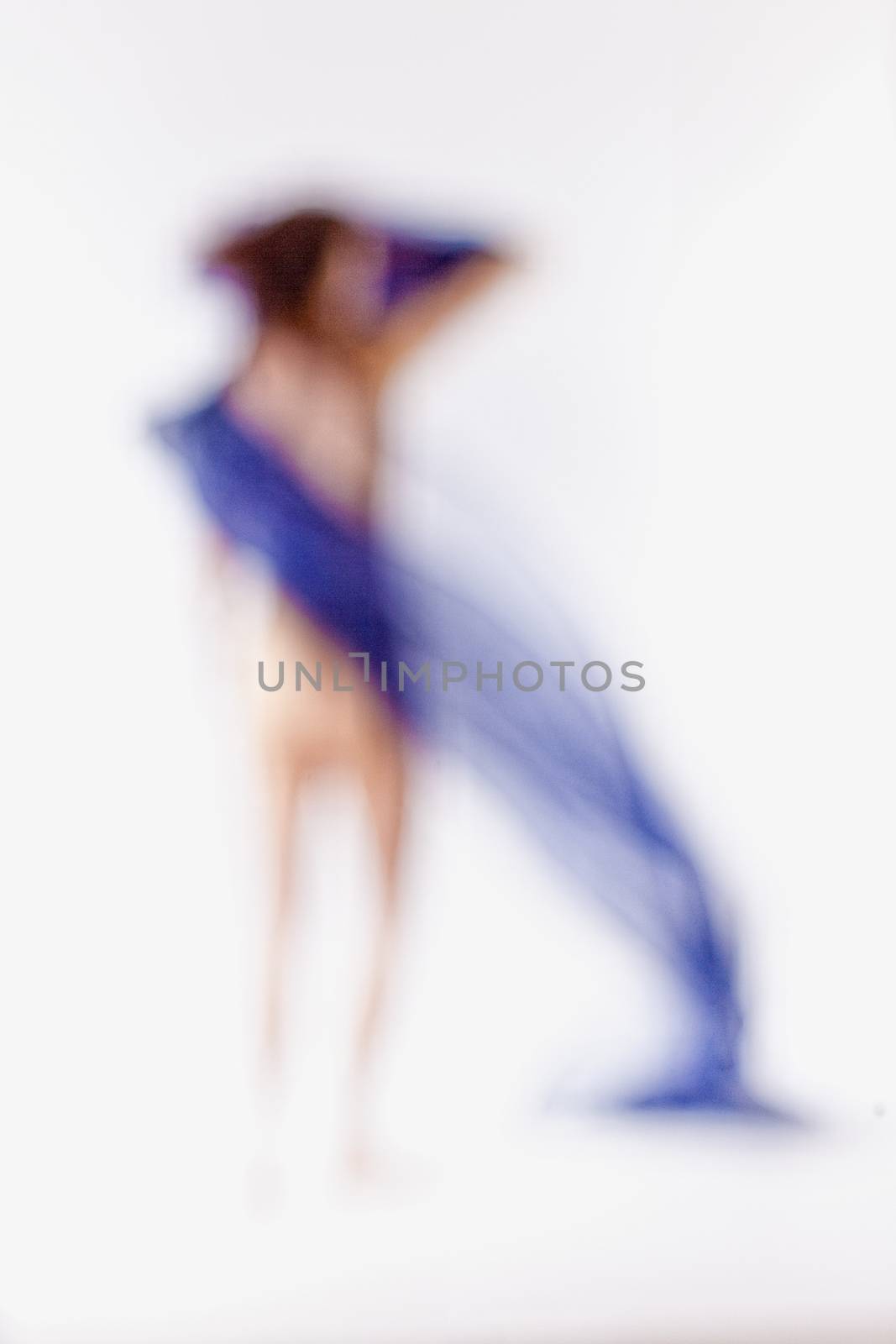 Out of Focus Image of a Woman with Blue Cloth by courtyardpix