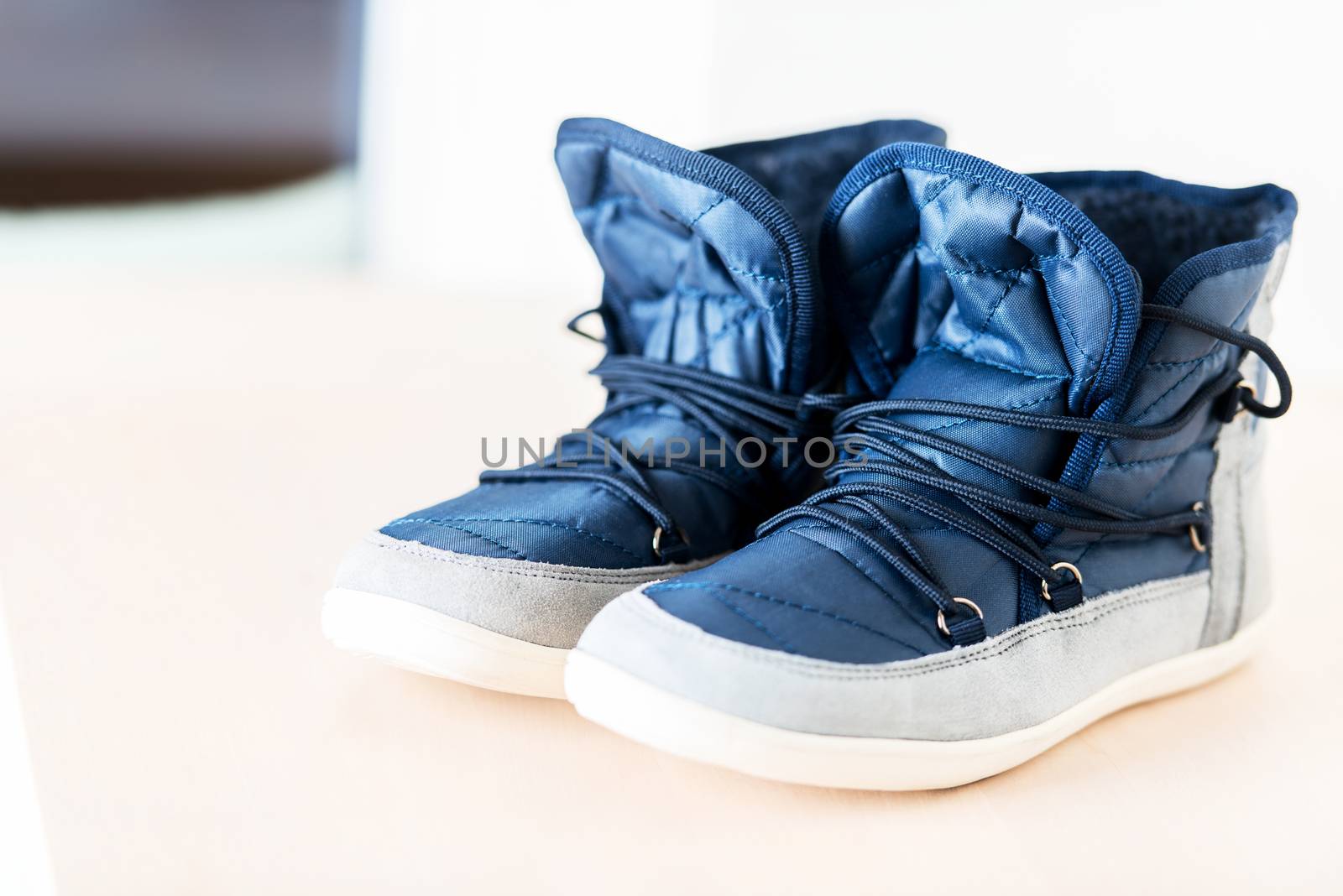 Pair of dark blue female boots by Nanisimova