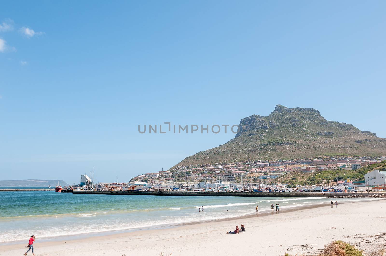 CAPE TOWN, SOUTH AFRICA - DECEMBER 12, 2014:  Hout Bay harbor, a beach and part of the town