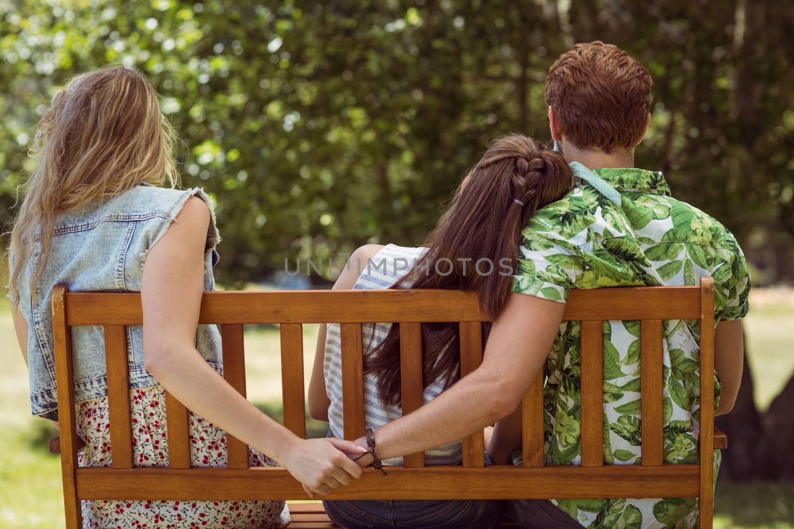 Young man holding hand of wrong girl by Wavebreakmedia