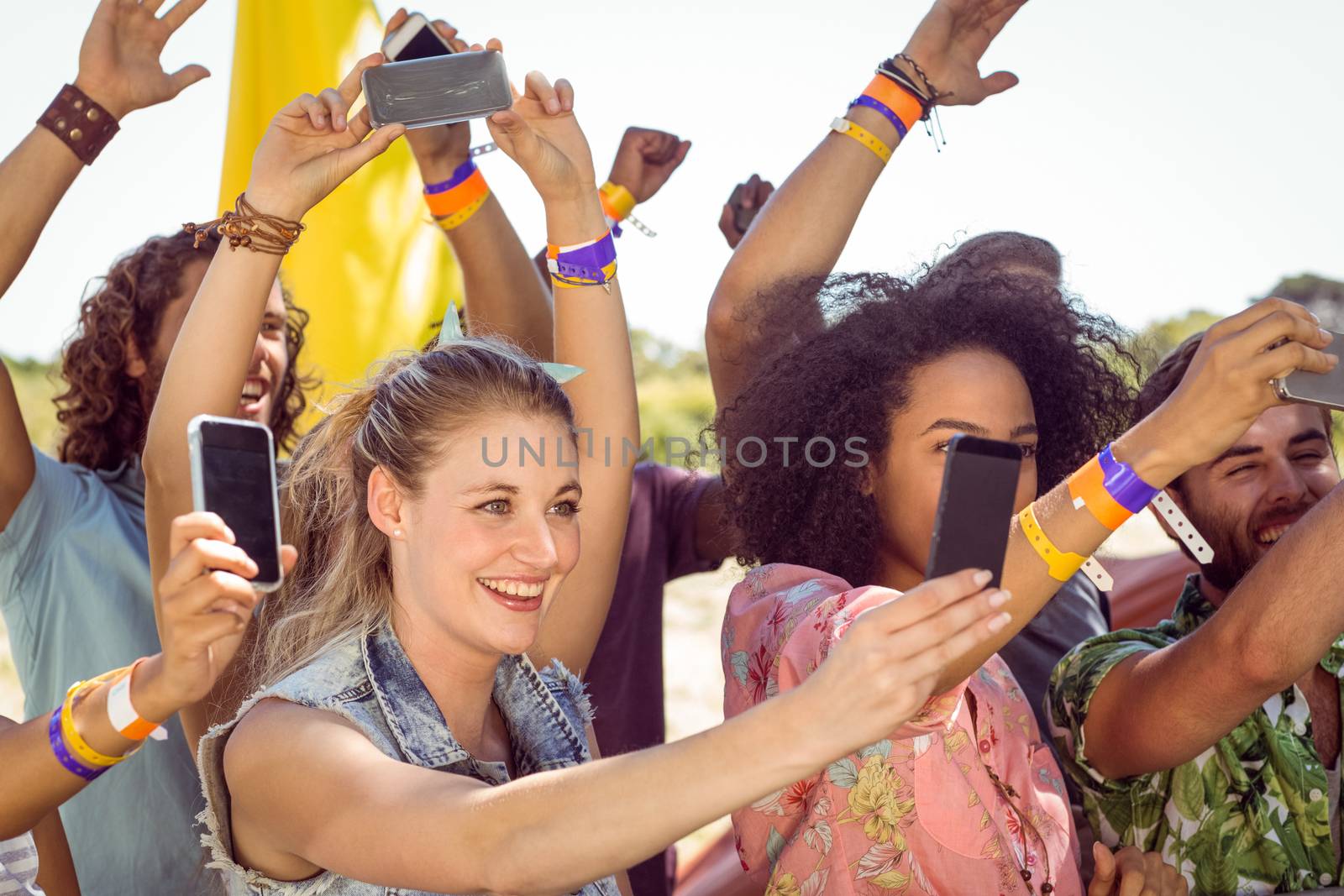 Excited music fans up the front at a music festival 