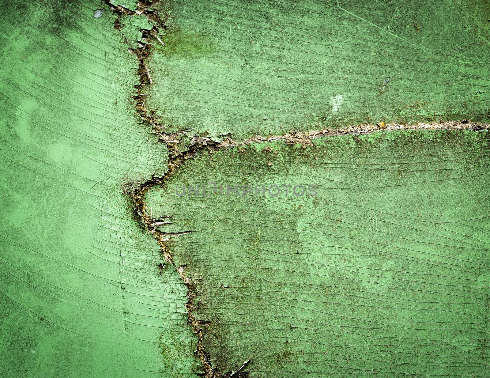 background or texture a crack in the green fiberglass