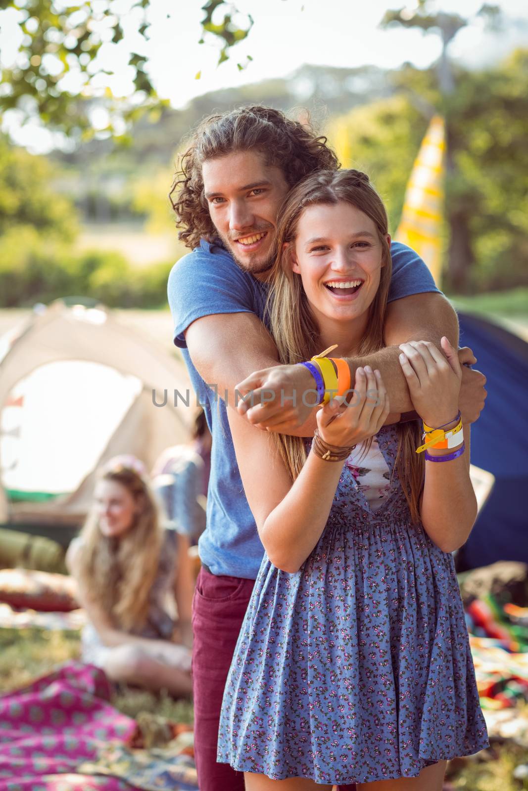 Hipster couple smiling at camera by Wavebreakmedia