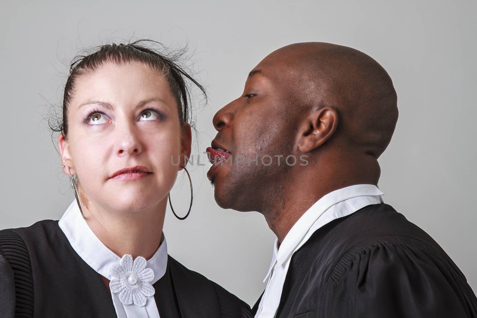man trying to lick a woman ear, both wearing canadian lawyer toga