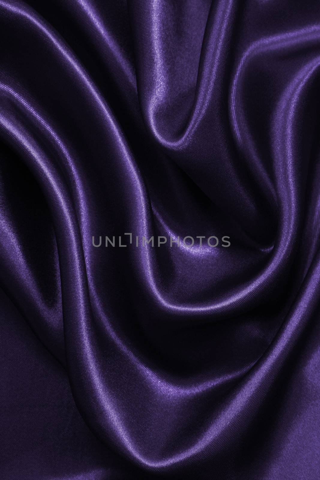 Smooth elegant lilac silk or satin as background 