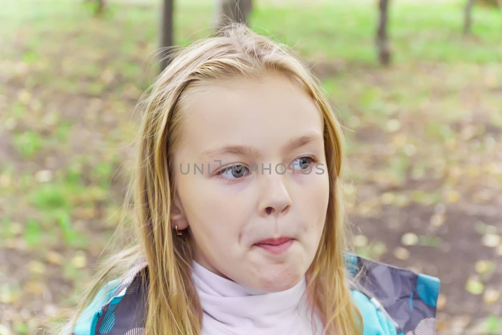 Photo of chewing cute girl with blond hair
