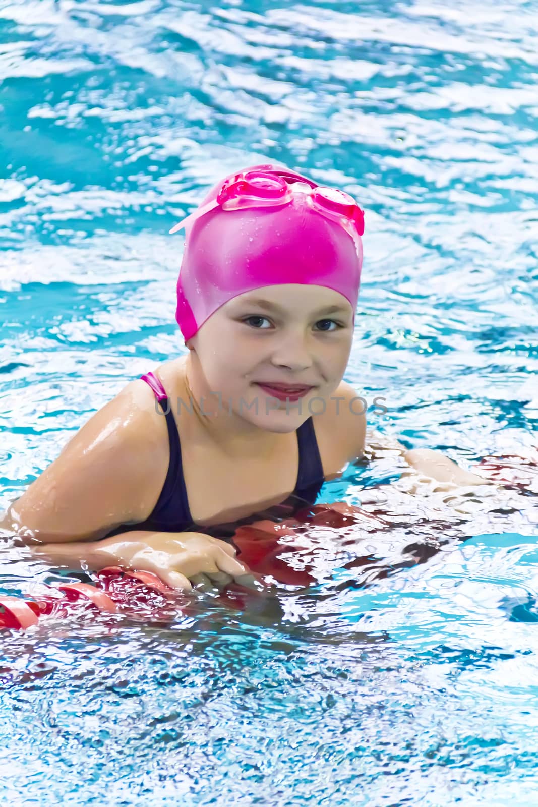 Photo of cute girl in swimming pool
