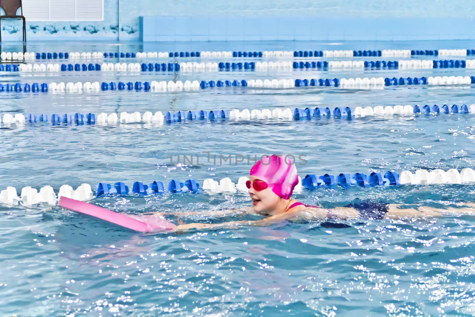Photo of cute girl in swimming pool