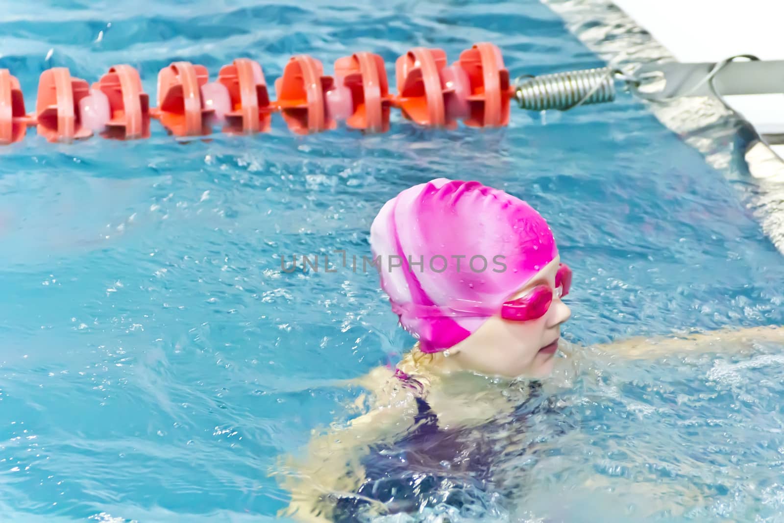 Photo of cute girl in swimming pool