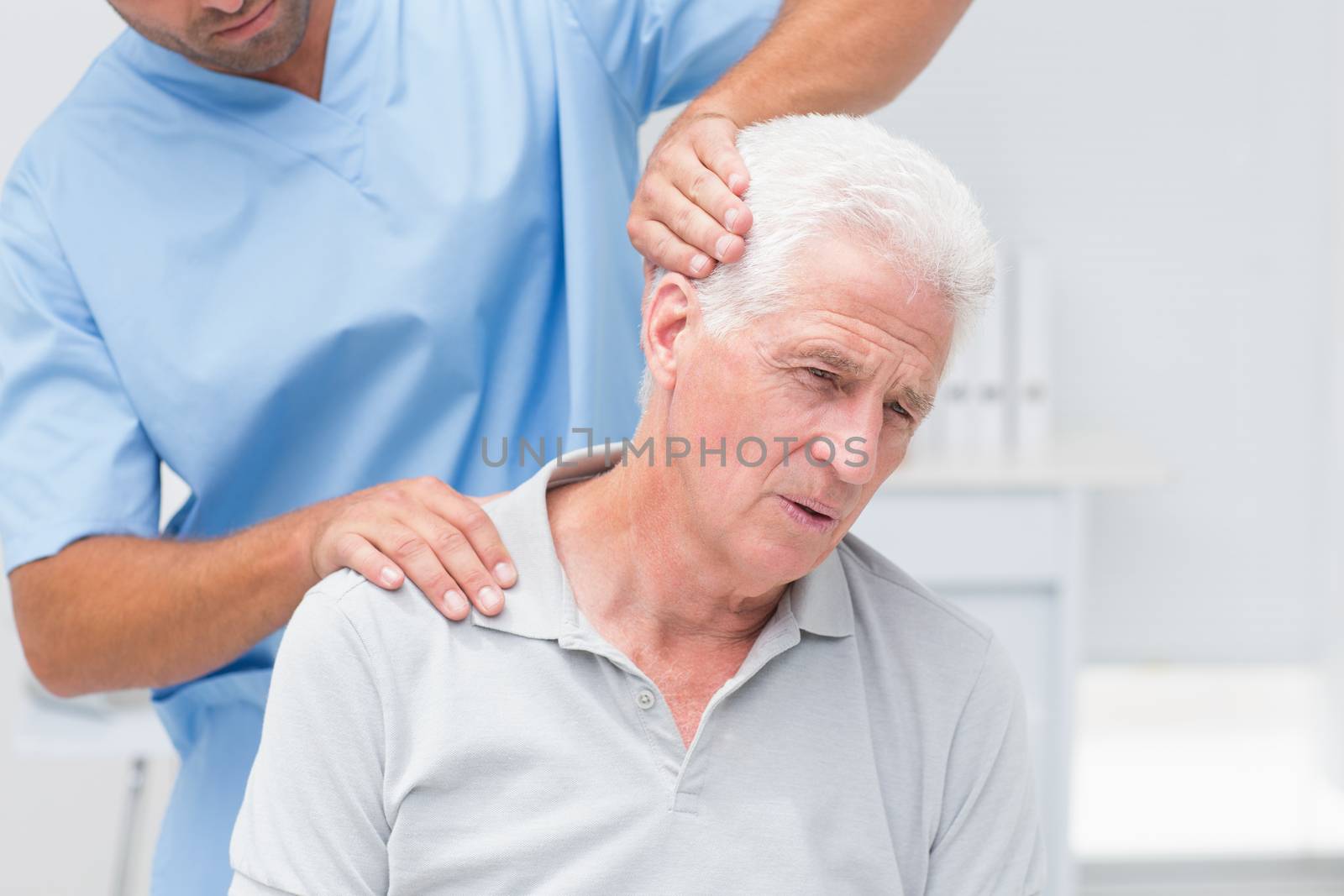 Physiotherapist giving physical therapy to senior patient by Wavebreakmedia