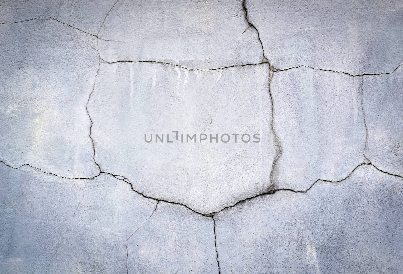 abstract background or texture old plaster split with cracks