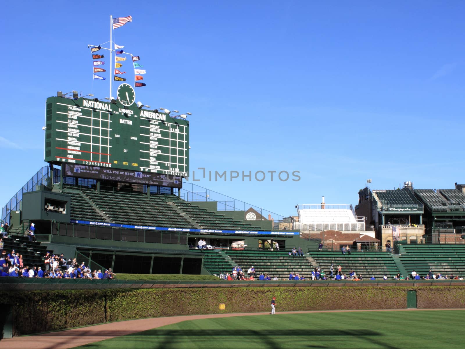 Wrigley Field bleacher fans watch an early season Cubs baseball game in Chicago.