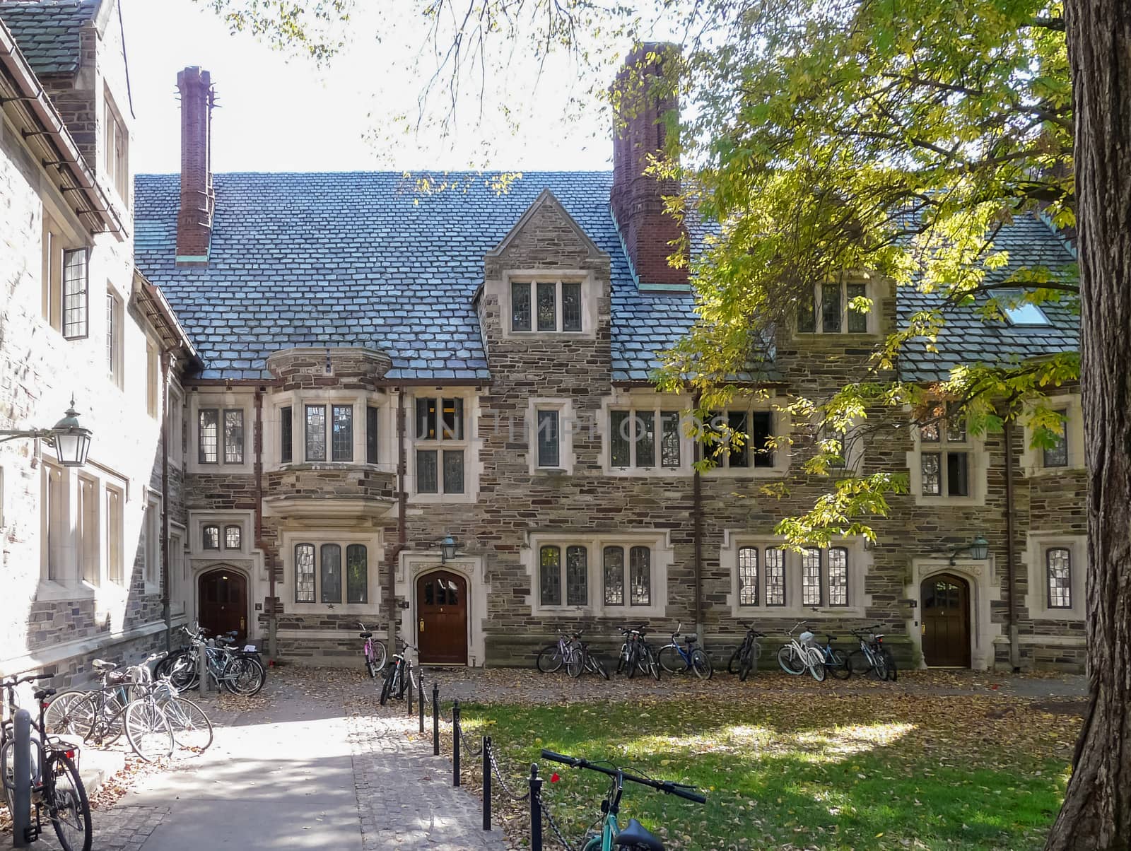 PRINCETON, NJ - OCTOBER 20: Colorful autumn in one of the best and oldest universities in USA, belonging to elite Ivy Leaque, classified at the 1-st place in ranking. Student's bicycles by campus dormitories, October 20, 2013 in Princeton, NJ
