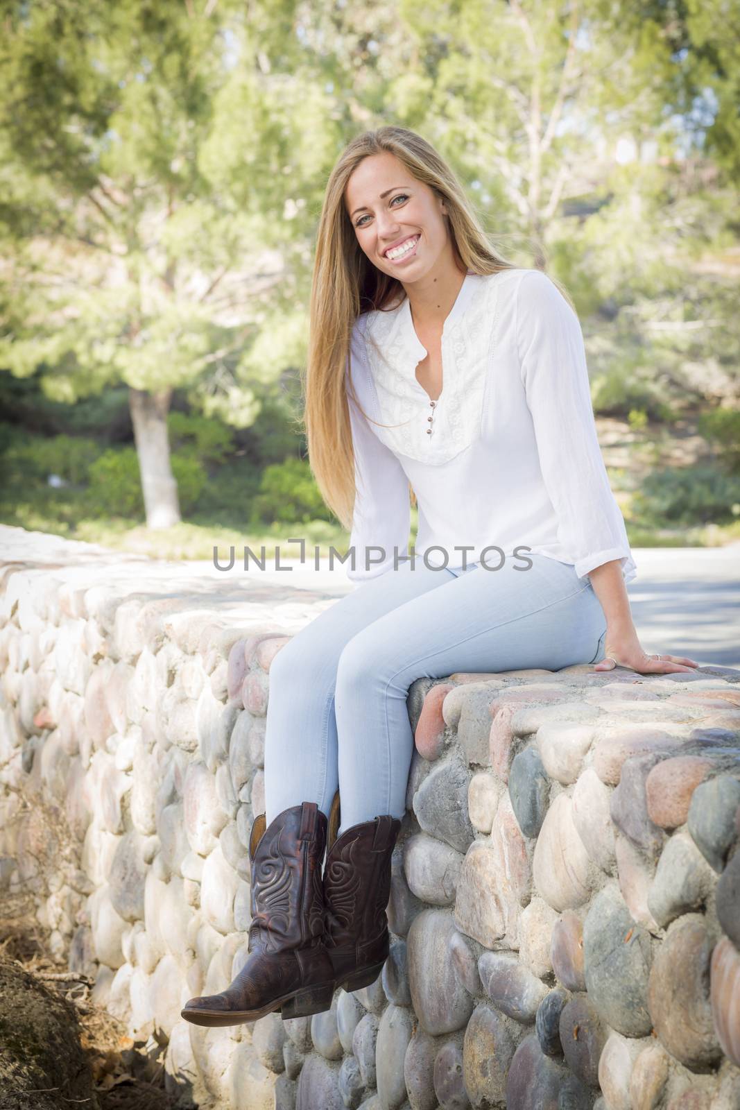 Portrait of a Beautiful Young Woman Outdoors at the Park.