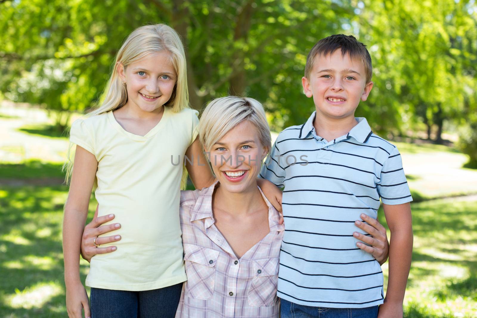 Pretty blonde with her children on a sunny day