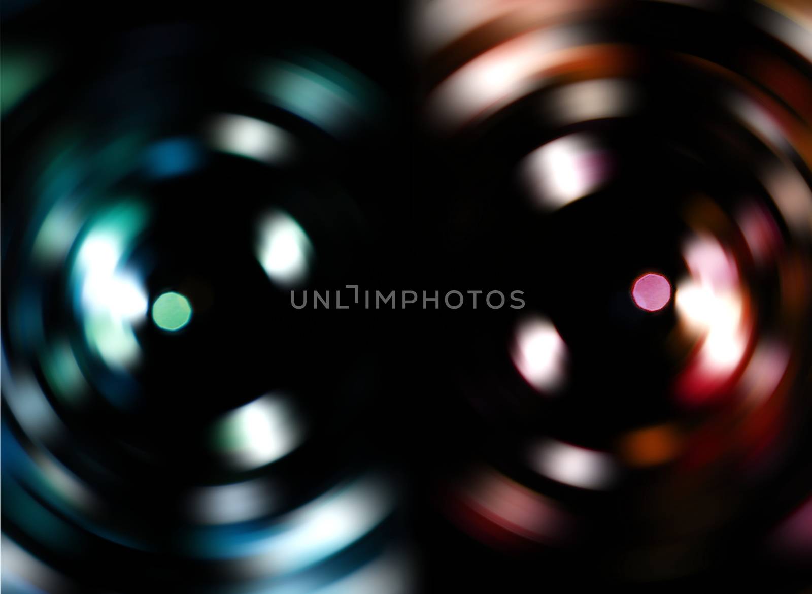 Two colorful blur vortexes isolated on black background.