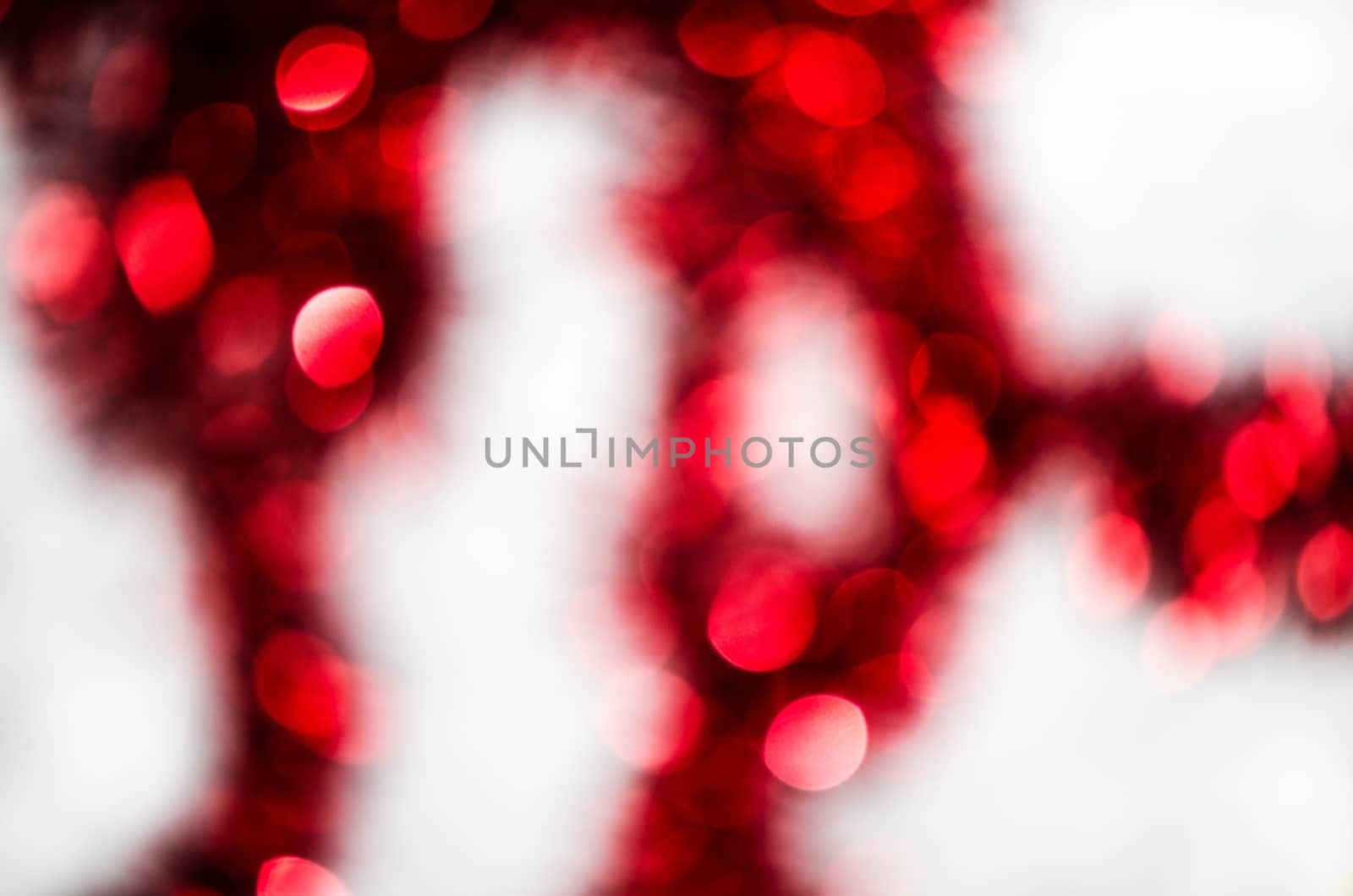 Red silver circle blur lights as christmas background.