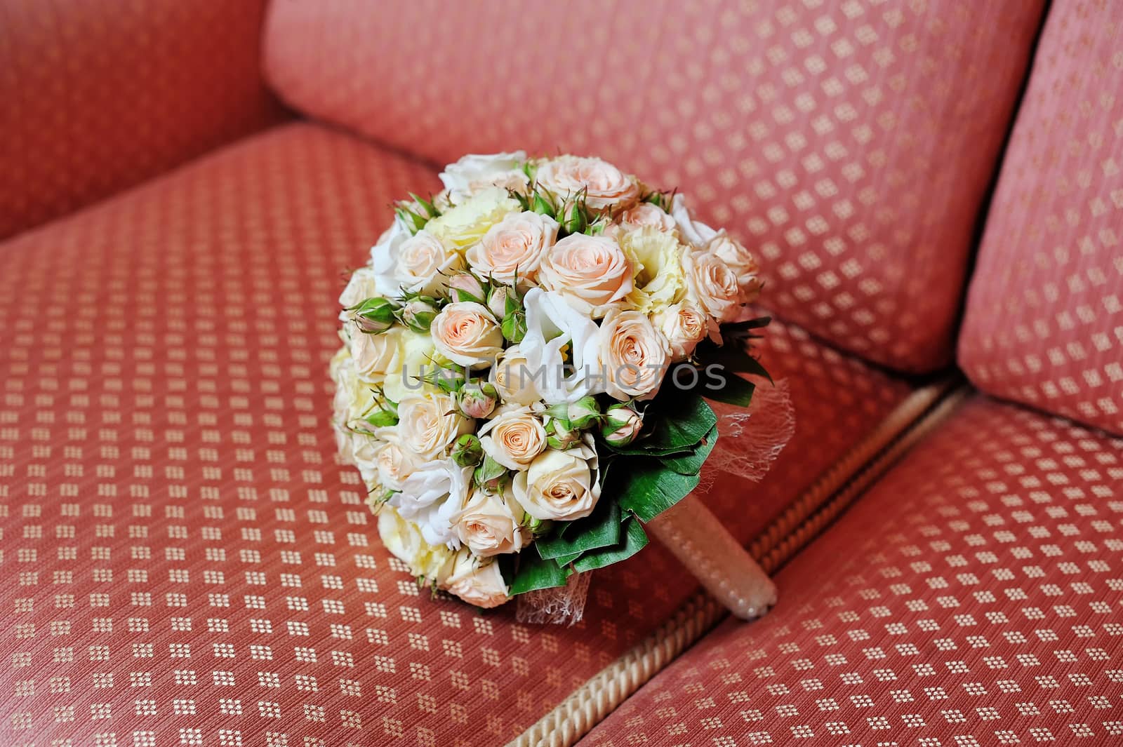 wedding bouquet on sofa.