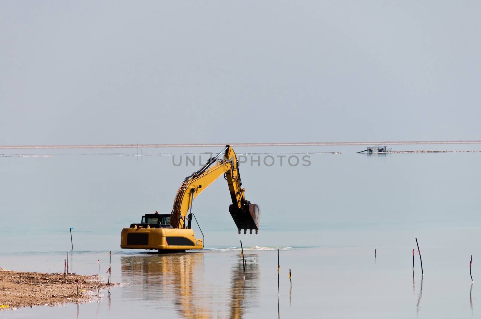Deepening large bulldozer seabed near the beach on the Dead Sea