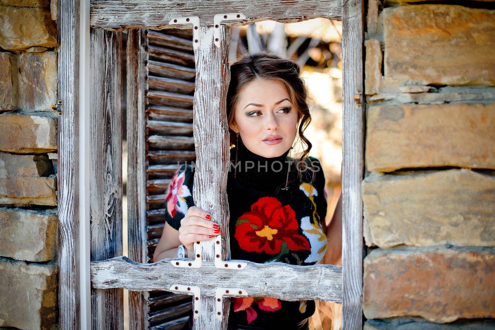 beautiful girl in windows on nature background