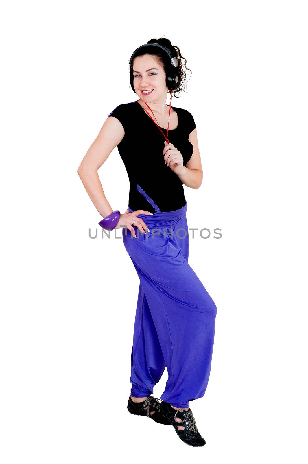 Isolate against white background. Girl doing exercises dancing to the music 