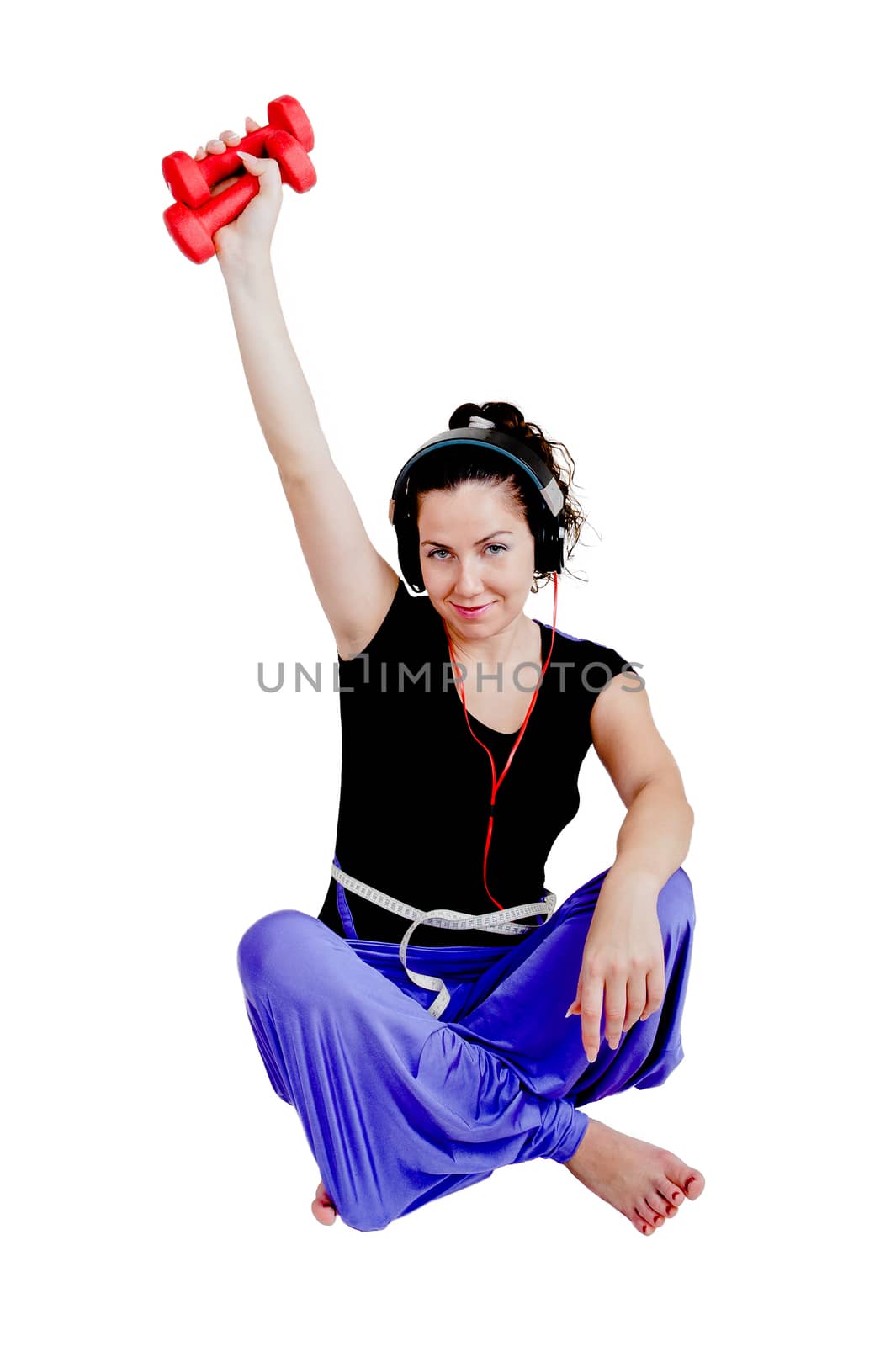 Isolate against white background. Girl shows how she plays sports with dumbbells and it helps her life; in good shape. 