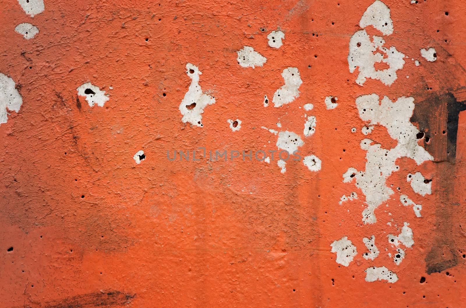 Orange black white painted chappy wall texture background.